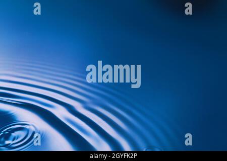 Pure blue water with ripples in corner Stock Photo