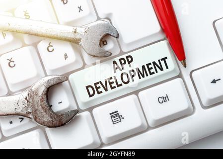 Text showing inspiration App Development, Business overview the act or process by which a mobile app is developed Typing Device Instruction Manual, Po Stock Photo