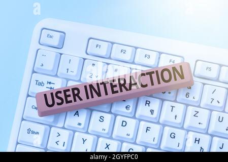 Hand writing sign User Interaction, Conceptual photo the conduit between human and computer interaction Abstract Fixing Outdated Websites, Maintaining Stock Photo