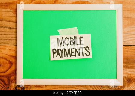 Inspiration showing sign Mobile Payments, Business idea money paid for a product through a electronic device Display of Different Color Sticker Notes Stock Photo