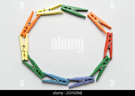 Frame made of clothespins on grey background Stock Photo