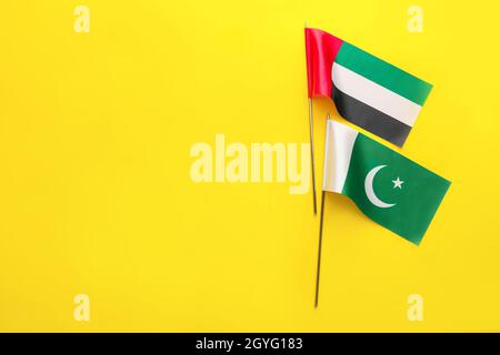 National United Arab Emirates and Pakistan flags on yellow background Stock Photo