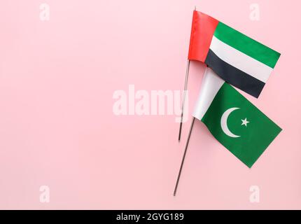 National UAE and Pakistan flags on pink background Stock Photo