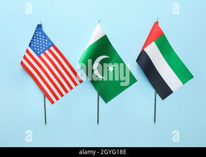 National USA, Pakistan and UAE flags on blue background Stock Photo