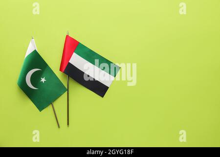 National UAE and Pakistan flags on green background Stock Photo