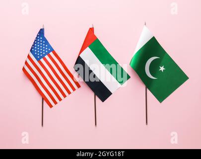 National UAE, USA and Pakistan flags on pink background Stock Photo