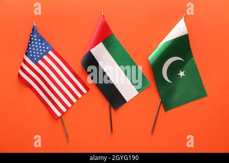 National UAE, USA and Pakistan flags on red background Stock Photo