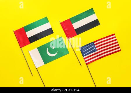 National UAE, USA and Pakistan flags on yellow background Stock Photo