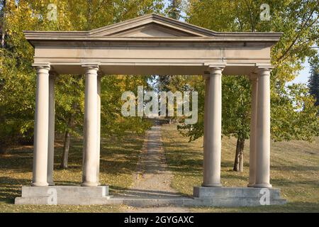 Neoclassical sandstone ceremonial arch at the entrance to the Reader Rock Garden and Union Cemetery in Calgary, Alberta, Canada Stock Photo