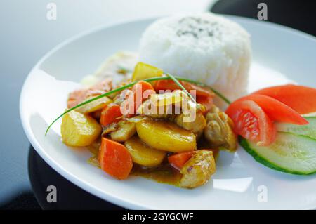 Chicken curry with carrot potatoes and black sesame on rice Stock Photo