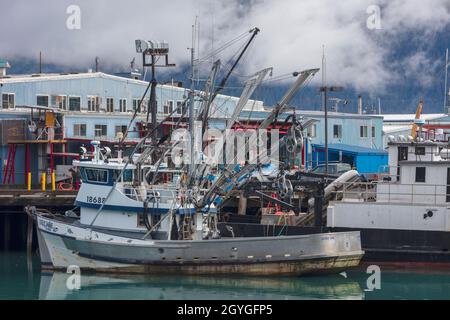 A FISHING BOAT is docked in RESURRECTION BAY in the SEWARD HARBOR of ALASKA. Stock Photo