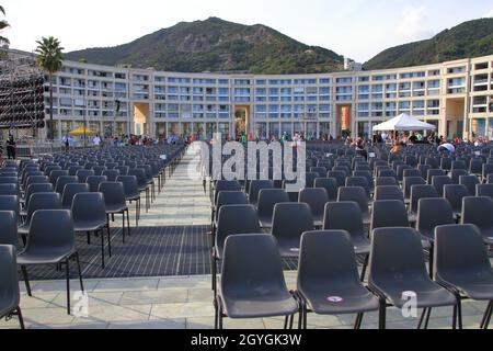 Chairs in Piazza Libertà ready to welcome the faithful and religious during the celebration of Holy Mass of the patron saint Saint Matthew. Stock Photo