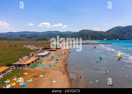 Akyaka Mugla Province, Ula Turkey kite surfing destination aerial view over the kitesurfing schools, beach the sea and river. Kiteboarding drone drone Stock Photo