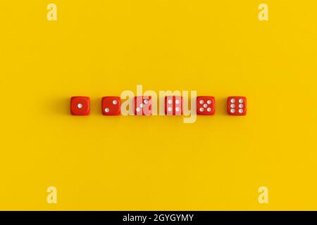 Red gaming dices on yellow background. Game concept Stock Photo