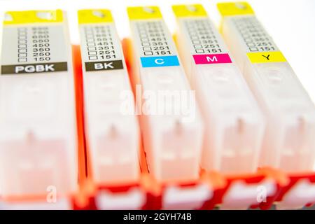 Five refilling cartridges for ink-jet printer on a light background Stock Photo