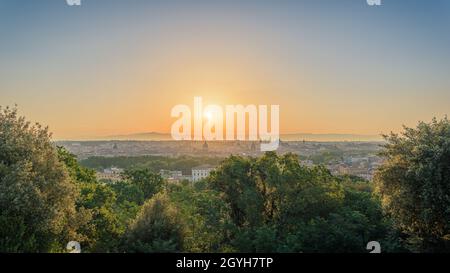 Panoramic view of Rome, Italy, at sunrise, from the Janiculum Hill viewpoint, with Trastevere district, Villa Medici, Spanish Steps, Pantheon, Quirina Stock Photo