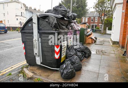 Two rubbish bins for recycling standing next to each other on a path ...