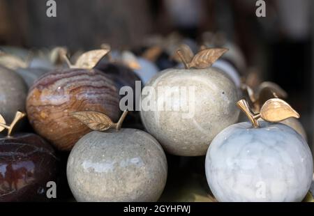 Marbled patterned apples. Too many over the counter for sale. . Stock Photo