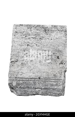 front view closeup of large vertical square fragment of antique classical stone column with weathered texture isolated on white background Stock Photo