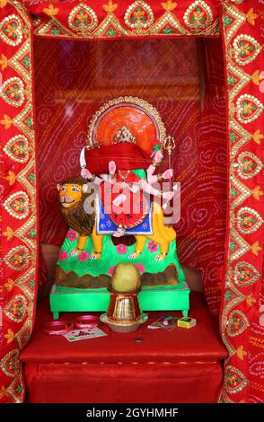 Beawar, India. 07th Oct, 2021. Beawar, Rajasthan, India, Oct.7, 2021: Idol of Hindu Goddess Durga seen at an empty pandal on the first day of the 9-day long Navratri festival in Beawar. Navratri festival marks the victory of Goddess Durga over the evil buffalo demon Mahishasura. Thus, Durga Puja festival epitomises the victory of Good over Evil in Hindu mythology, culminates in the immersion of idols in bodies of water. The festival will continue till October 15. Credit: Sumit Saraswat/Alamy Live News Stock Photo