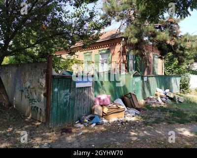 Abandoned house littered with rubbish Stock Photo