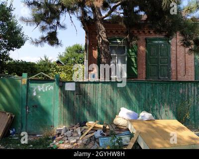 Abandoned house littered with rubbish Stock Photo