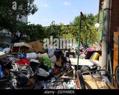 Abandoned yard full of rubbish Stock Photo