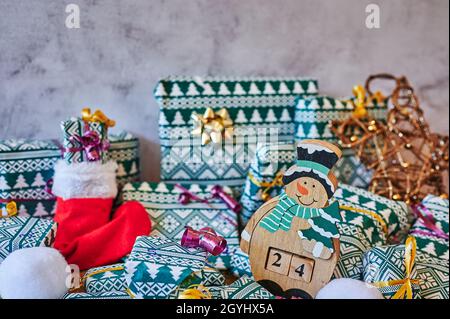 Wrapped gifts that are part of an advent calendar and Christmas decorations. Stock Photo