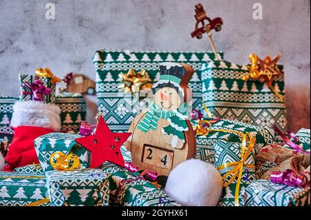 Wrapped gifts that are part of an advent calendar and Christmas decorations. Stock Photo