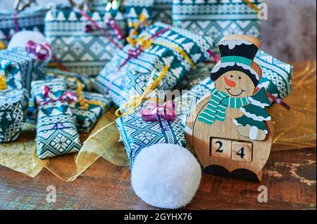 Wrapped gifts that are part of an advent calendar and Christmas decorations. Stock Photo