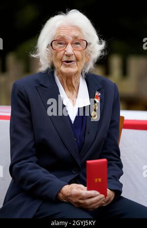 WW II veteran, 96-year-old Lorna Cockayne, who served in the Women's Royal Naval Service (WRNS), popularly and officially known as the Wrens, as a Bletchley Park codebreaker, with the Legion d'honneur after receiving it during a ceremony at the Pear at Parley in Ferndown, Bournemouth from Commodore Jude Terry RN. Picture date: Friday October 8, 2021. Stock Photo