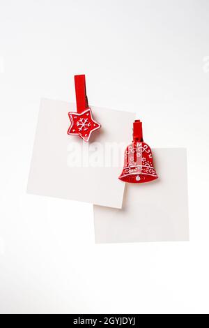 two christmas notes with red clothespins on the background. copy space Stock Photo