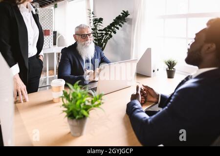 Business people discussing over new investment project inside office - Entrepreneurship concept Stock Photo