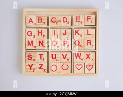Wooden alphabets blocks, education toys isolated on white background Stock Photo