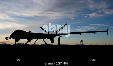 Airmen from the 29th Aircraft Maintenance Unit check over the first MQ-9 Reaper to be transported through ferry flight here, Jan. 8, 2020, on Holloman Air Force Base, N.M. Transporting remotely piloted aircraft from California meant using the National Airspace System and required extra documentation to permit the flight. (U.S. Air Force photo by Airman 1st Class Autumn Vogt) Stock Photo