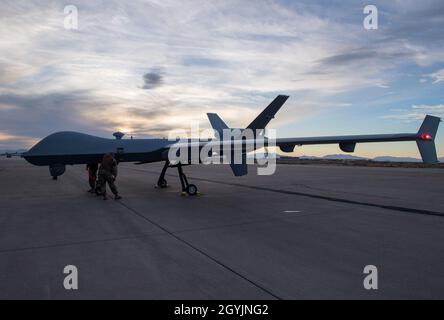 Airmen from the 29th Aircraft Maintenance Unit look over the 49th Wing’s newest MQ-9 Reaper, Jan. 8, 2020, on Holloman Air Force Base, N.M. This is the first remotely piloted aircraft to be ferried through the National Airspace to Holloman. (U.S. Air Force photo by Airman 1st Class Autumn Vogt) Stock Photo