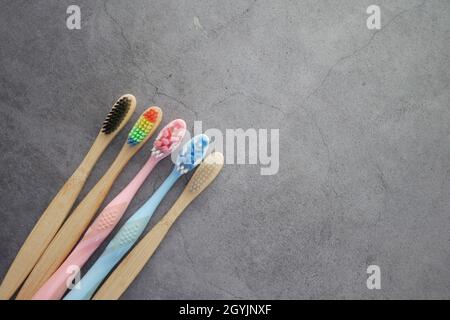 colorful toothbrushes on a black background with copy space  Stock Photo
