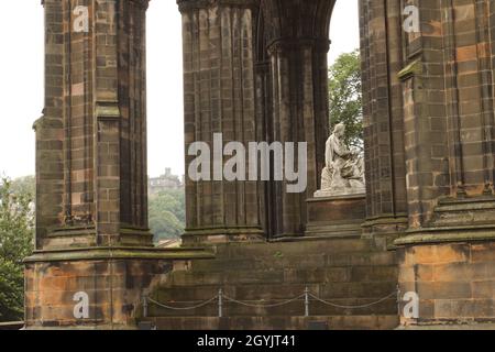 Statue of Sir Walter Scott, Scott Monument, with Edinburgh Castle in the background, Edinburgh, Scotland, UK Stock Photo