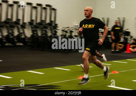 Georgia Army National Guardsman, Sgt. Brandon Henderson, a paralegal noncommissioned officer with the Marietta-based, 1732 Trial Defense Service, completes the Sprint event during Army Combat Fitness Test training at Clay National Guard Center, Marietta, Ga., Jan. 11, 2020.  Soldiers are required to complete 250 meters sprinting, dragging and carrying various equipment as fast as possible.    U.S. Army National Guard photo by Sgt. 1st Class R.J. Lannom Jr. Stock Photo