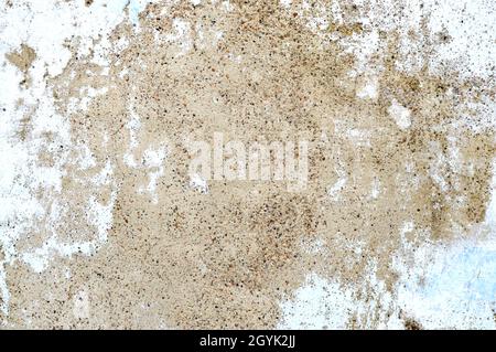 Concrete grey wall with old cracked paint. Black, grey, white and beige colors. Abstract photo background. Urban style texture. Building exterior. Cem Stock Photo