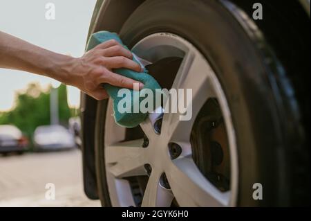 Man using sponge, hand car wash Stock Photo