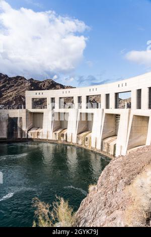 Parker Dam is a concrete arch-gravity dam built on the Colorado River in 1938 & impounds Lake Havasu between Arizona & California. Stock Photo