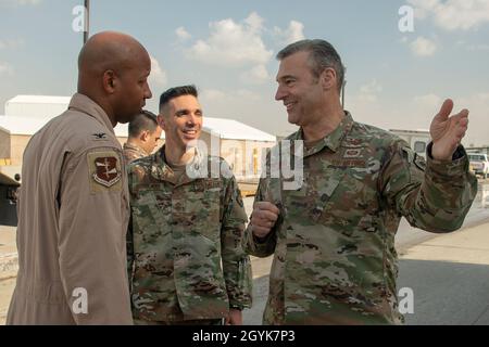 U.S. Air Force Lt. Gen. Joseph T. Guastella Jr., U.S. Air Forces Central Command commander (right), speaks with U.S. Air Force Col. Jaron Roux, 380th Air Expeditionary Wing vice commander, at Al Dhafra Air Base, United Arab Emirates, Jan. 15, 2020. The AFCENT command team met with leadership and hosted an aircrew all-call where they talked about the importance of Airmen in the joint fight and AFCENT’s role in current operations. (U.S. Air Force photo by Tech. Sgt. Kat Justen) Stock Photo
