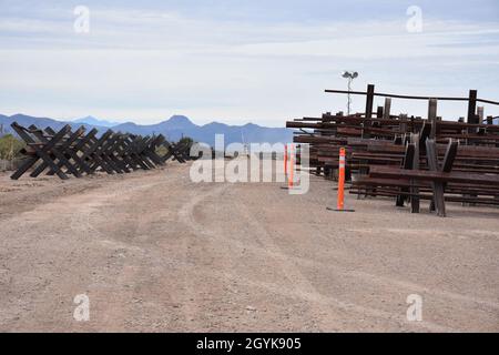 Existing outdated Normandy-style vehicle barriers (left) await removal at the Tucson 3 project near Douglas, Arizona, January 15, 2020. The Tucson 3 project spans approximately 20 miles, replacing dilapidated and outdated designs with a steel bollard barrier system. The U.S. Army Corps of Engineers, South Pacific Border District is providing contracting services, including design and construction oversight, of Department of Defense-funded Southwest border barrier projects in California, Arizona, New Mexico and Texas at the direction of the Administration and at the request of Department of Hom Stock Photo