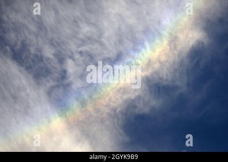 Iridescent clouds / "fire rainbow" / "rainbow clouds" - rainbow formed in cirrus clouds above London, England, UK. October Stock Photo