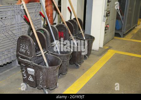 All the mop buckets lined up in a row at Production Plant Barstow, Marine Depot Maintenance Command, are indicative of their Continuous Process Improvement, Lean Six Sigma methodologies, which ensure that everything has a place and everything goes in that place, and that place is clearly marked or labeled, on the Yermo Annex aboard Marine Corps Logistics Base Barstow, Calif., Jan. 15. Stock Photo
