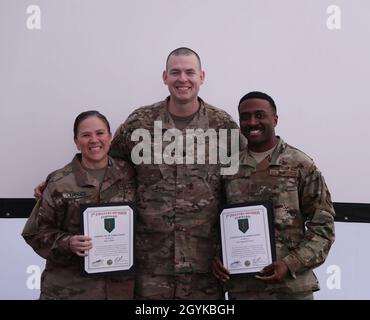 Becky LaPolice, an American Red Cross representative, and Air Force Capt. Nathaniel F. Shearer, 1st Infantry Division’s staff weather officer, are presented certificates of appreciation from Army Lt. Col. Joshua LaMotte, 1 ID FWD Chief of Staff, for their speeches honoring Dr. King’s life during 1st Infantry Division Forward’s Martin Luther King Jr. Day celebration, an event celebrating Dr. King’s life of service with a theme of ‘A Day On, Not a Day Off’, on January 16, 2020, in Poznan, Poland.(U.S Army National Guard photo by Sgt. Anna Churco) Stock Photo