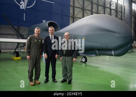 17 Jan. 2020  Supreme Allied Commander Europe (SACEUR), the Chairman of Military Committee, Air Chief Marshal Sir Stuart Peach and NATO Secretary General Mr. Jens Stoltenberg pose for a photo in front of the NATO RQ-4D aircraft called “Phoenix” presented in the hangar on Sigonella airbase in Italy after a ceremony.  The ceremony marks the delivery of AGS remotely piloted aircraft. AGS System is comprised of five NATO RQ-4D aircrafts called “Phoenix” and the associated ground command. With the new acquired AGS NATO will undertake various surveillance and reconnaissance missions and monitor wide Stock Photo