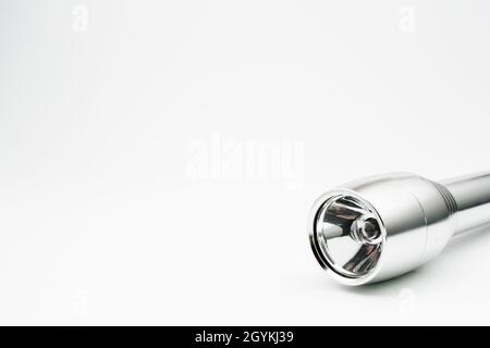 silver flashlight with isolated empty background Stock Photo