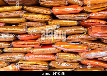 New tri-cloth stock wrapped in plastic for the preparation of offerings to the monks Stock Photo